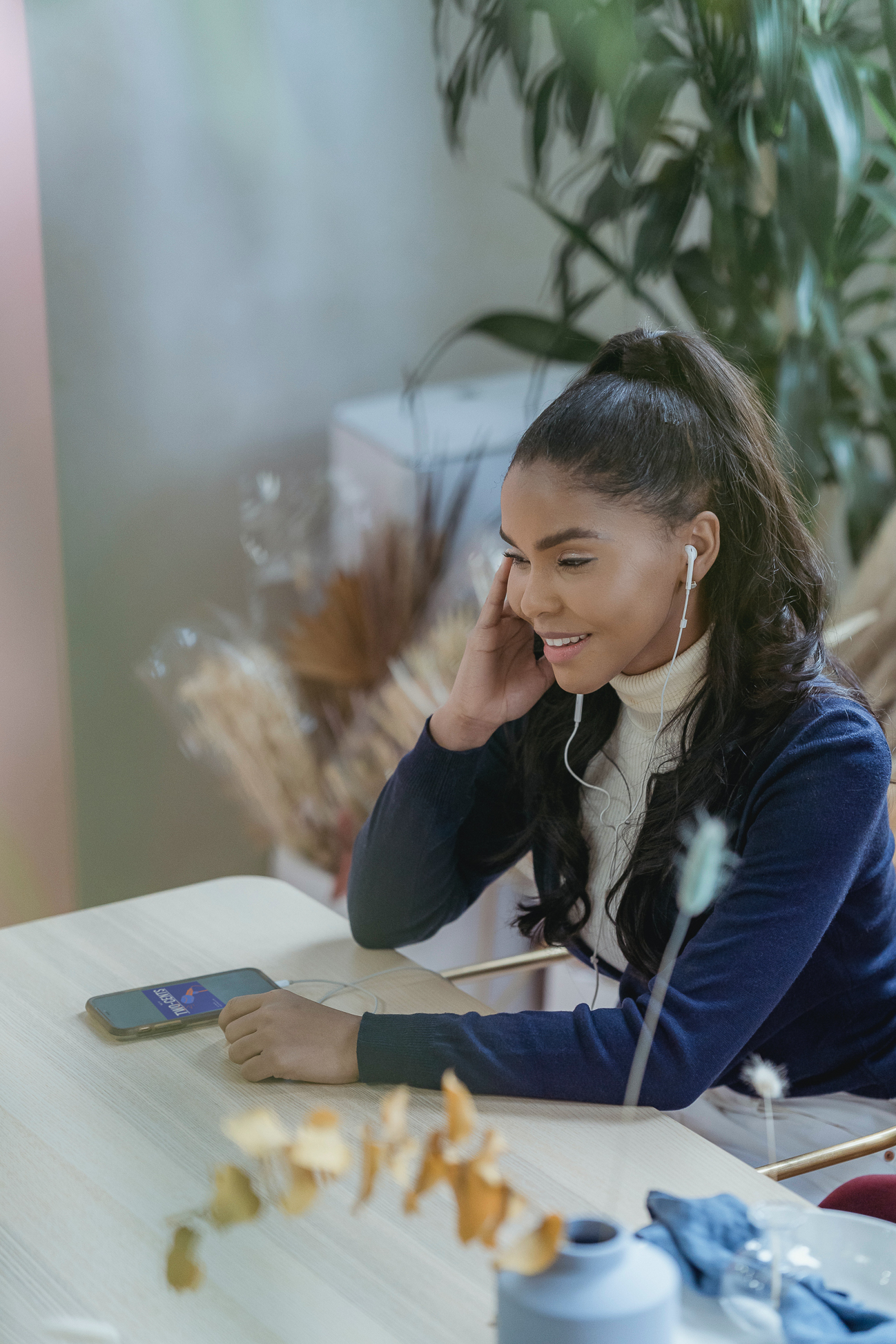 woman listening to a sales podcast on her phone